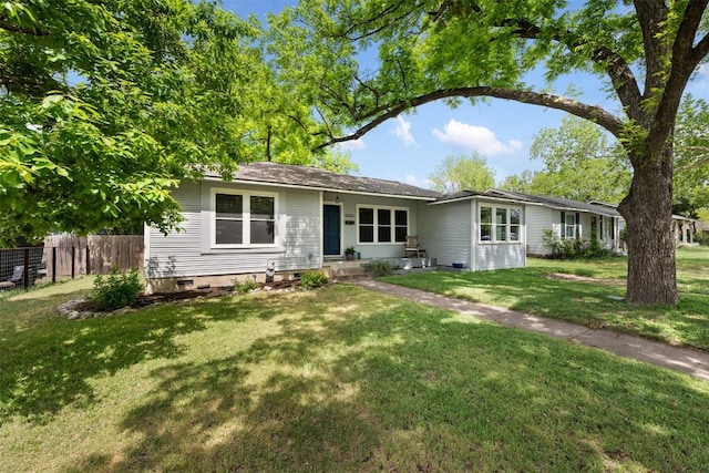 view of front of home with fence, a front yard, and crawl space