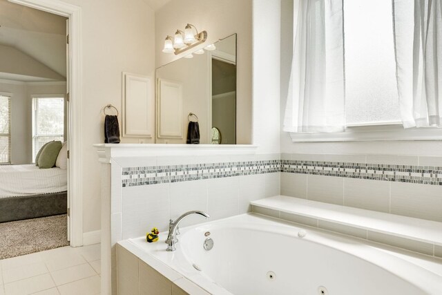 5313 Castana Bnd, Bee Cave, TX 78738 - bathroom featuring ensuite bath, a tub with jets, tile patterned flooring, and vaulted ceiling