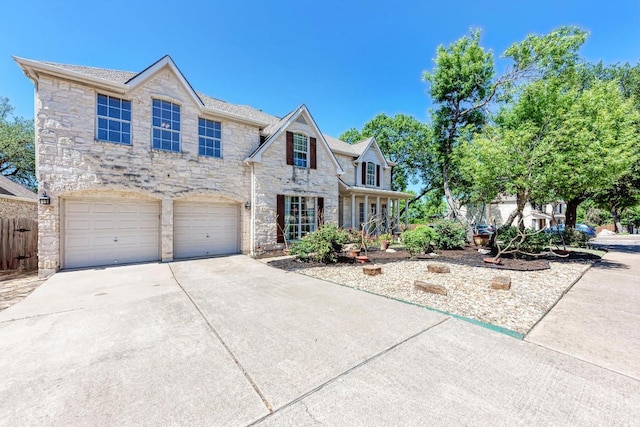 8236 Phantom Canyon Dr, Austin, TX 78726 - view of front of property with stone siding, concrete driveway, and a garage