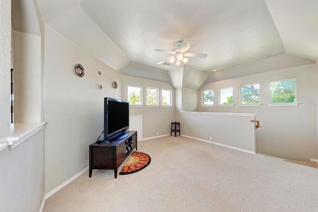 8236 Phantom Canyon Dr, Austin, TX 78726 - living area featuring ceiling fan, light colored carpet, lofted ceiling, and baseboards