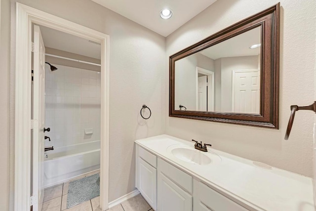 full bathroom with tile patterned flooring, shower / bath combination, vanity, baseboards, and visible vents