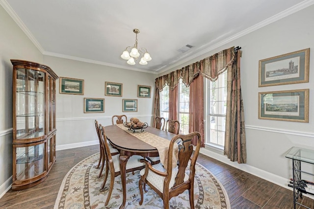 dining area featuring crown molding, a notable chandelier, visible vents, and baseboards