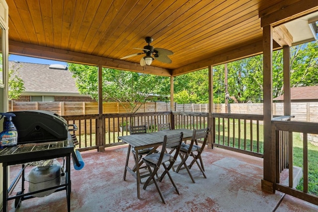 exterior space with ceiling fan, outdoor dining area, a shed, and a fenced backyard