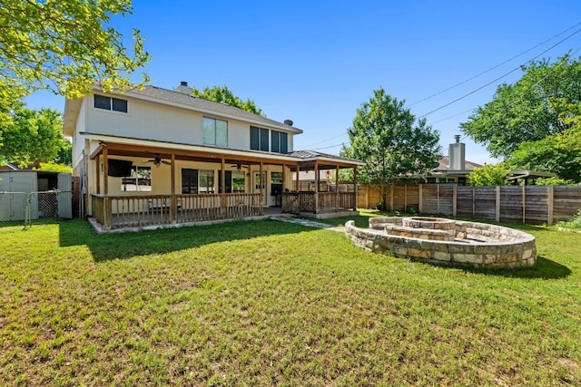 16918 Ardisia Dr, Pflugerville, TX 78660 - rear view of house featuring a fire pit, ceiling fan, a patio area, and a shed