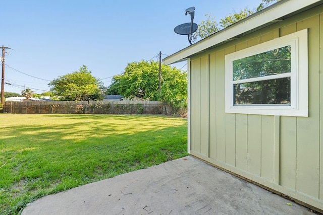 view of yard featuring fence and a patio area