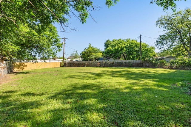 view of yard with a fenced backyard