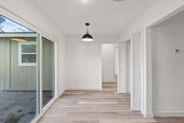 502 Oakley Ct, Austin, TX 78753 - hall with light wood-style flooring and baseboards