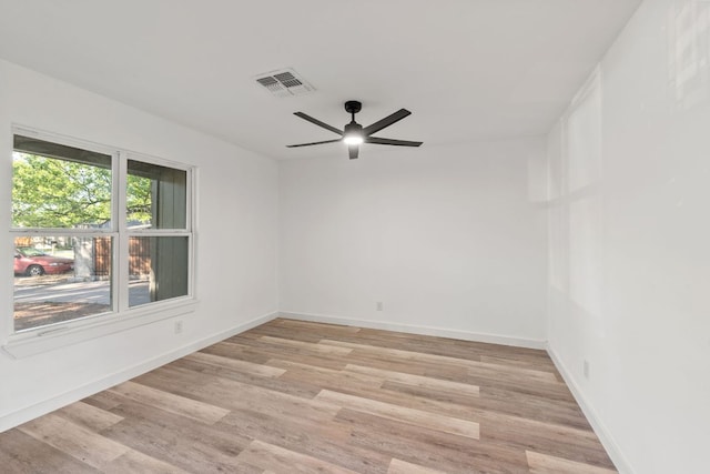 502 Oakley Ct, Austin, TX 78753 - unfurnished room with light wood finished floors, a ceiling fan, and baseboards