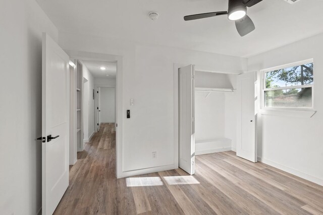 502 Oakley Ct, Austin, TX 78753 - unfurnished bedroom with light wood-style flooring, baseboards, a closet, and a ceiling fan
