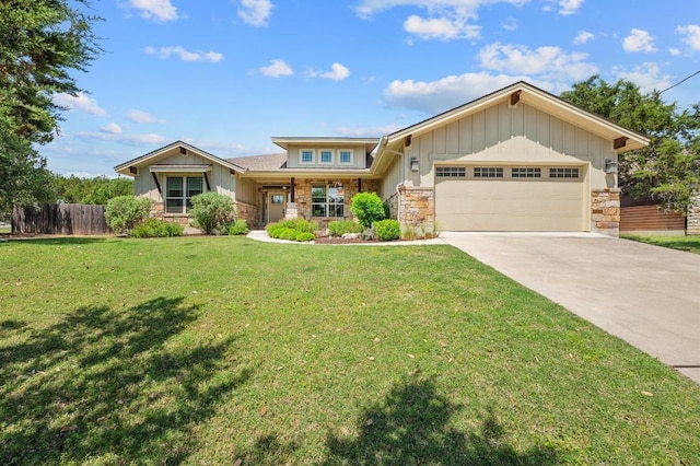 view of front of property featuring fence, a garage, board and batten siding, and stone siding