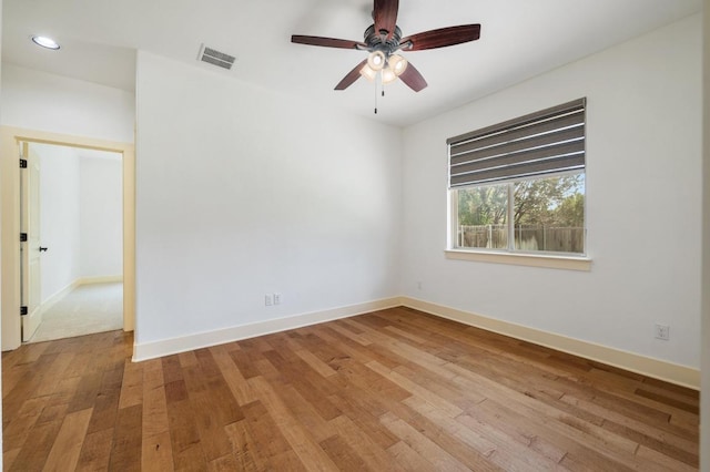 unfurnished room with recessed lighting, light wood-style flooring, baseboards, visible vents, and a ceiling fan