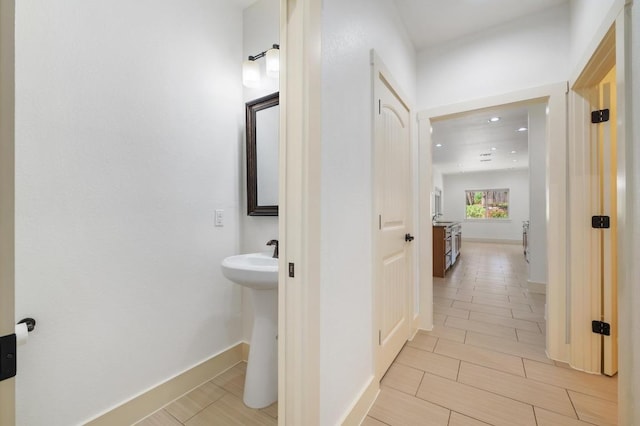 bathroom with recessed lighting and a sink