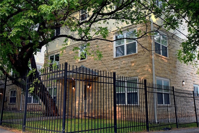 3007 Speedway Unit 6, Austin, TX 78705 - exterior space with stone siding and a fenced front yard