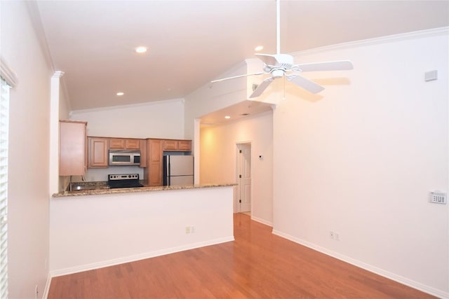 3007 Speedway Unit 6, Austin, TX 78705 - kitchen featuring crown molding, light wood-style flooring, appliances with stainless steel finishes, vaulted ceiling, and a ceiling fan