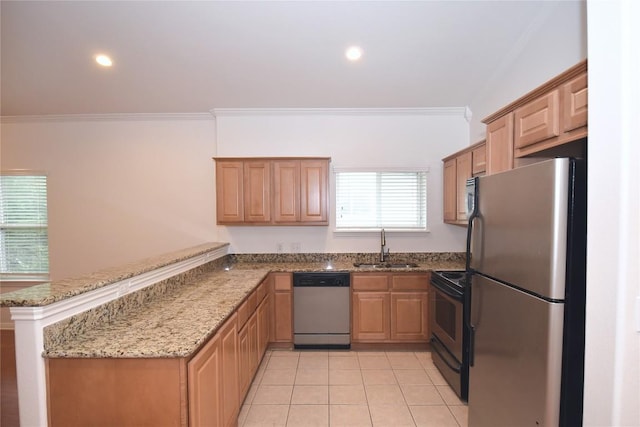 3007 Speedway Unit 6, Austin, TX 78705 - kitchen with a sink, stainless steel appliances, crown molding, light stone counters, and a peninsula
