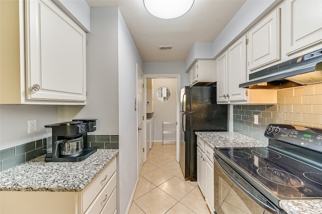 kitchen featuring light tile patterned floors, decorative backsplash, visible vents, under cabinet range hood, and black range with electric cooktop