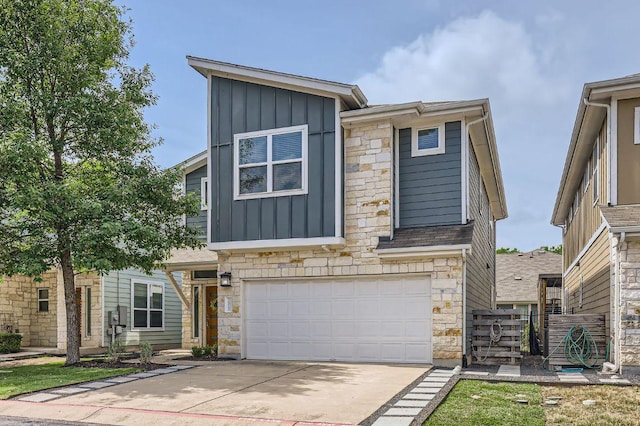 1513 Casa Dr, Austin, TX 78745 - contemporary house with board and batten siding, stone siding, a garage, and concrete driveway