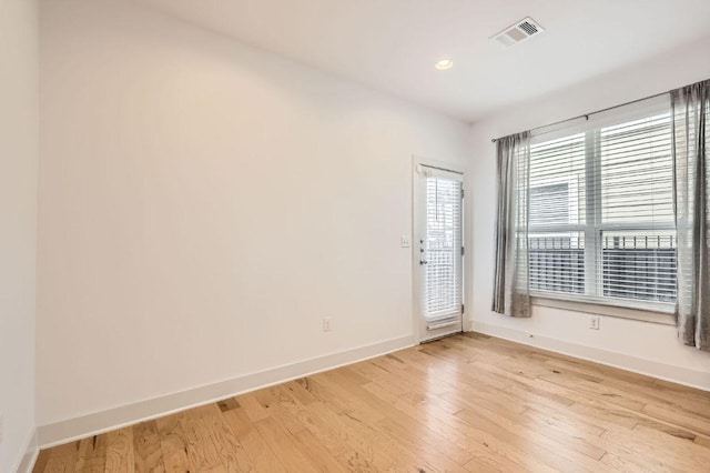 1513 Casa Dr, Austin, TX 78745 - spare room with baseboards, light wood finished floors, and recessed lighting