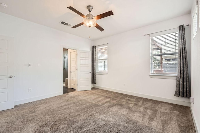 1513 Casa Dr, Austin, TX 78745 - unfurnished bedroom featuring carpet, baseboards, and ceiling fan