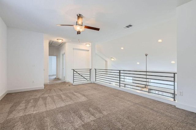 1513 Casa Dr, Austin, TX 78745 - carpeted spare room with attic access, a ceiling fan, baseboards, and vaulted ceiling