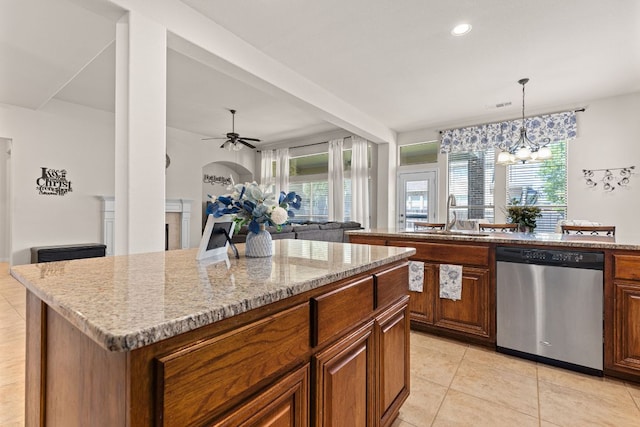 2812 Saint Rodrigo Ct, Round Rock, TX 78665 - kitchen featuring dishwasher, a kitchen island, open floor plan, a ceiling fan, and light tile patterned floors