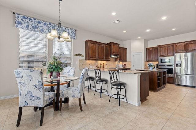 2812 Saint Rodrigo Ct, Round Rock, TX 78665 - dining area featuring a chandelier, recessed lighting, and light tile patterned floors
