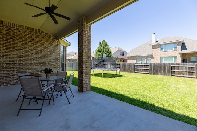 2812 Saint Rodrigo Ct, Round Rock, TX 78665 - fenced backyard featuring a patio area, ceiling fan, and a trampoline