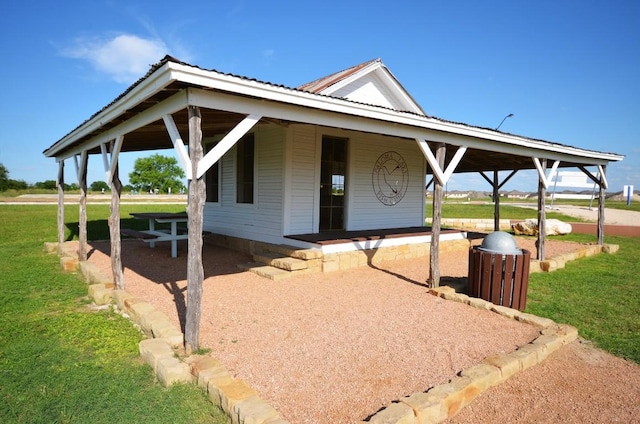 2812 Saint Rodrigo Ct, Round Rock, TX 78665 - view of front of property with a metal roof, a front lawn, and covered porch