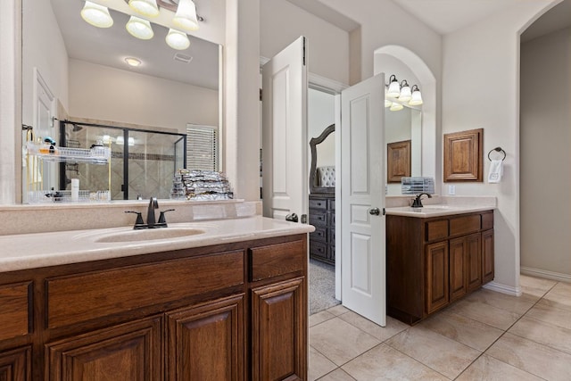 2812 Saint Rodrigo Ct, Round Rock, TX 78665 - bathroom featuring two vanities, a shower stall, and tile patterned floors