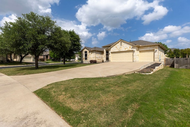 2129 Aaron Ross Way, Round Rock, TX 78665 - view of front of house featuring stone siding, driveway, and an attached garage