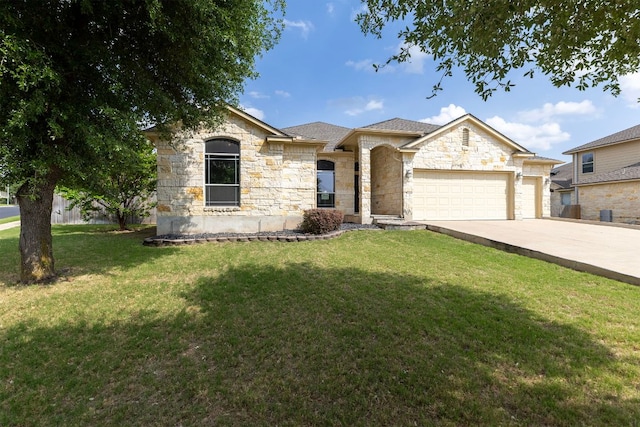 2129 Aaron Ross Way, Round Rock, TX 78665 - french provincial home with stone siding, concrete driveway, a front yard, and an attached garage