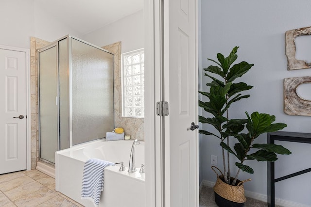 2129 Aaron Ross Way, Round Rock, TX 78665 - bathroom featuring a shower stall and a bath