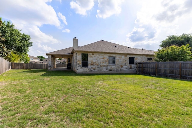 2129 Aaron Ross Way, Round Rock, TX 78665 - back of house with a chimney, a fenced backyard, a patio area, and stone siding