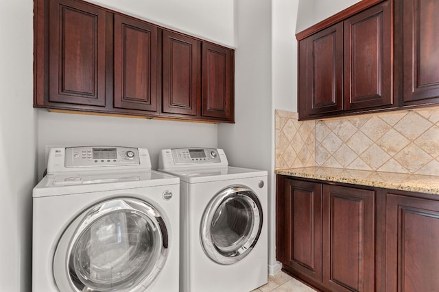 2129 Aaron Ross Way, Round Rock, TX 78665 - washroom with washing machine and clothes dryer and cabinet space