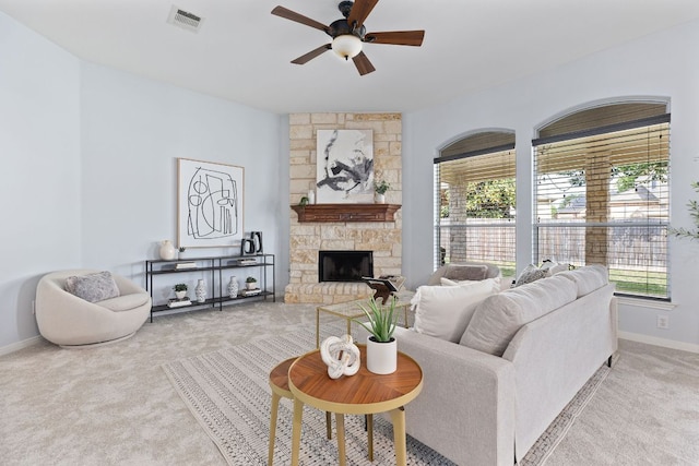 2129 Aaron Ross Way, Round Rock, TX 78665 - carpeted living area featuring a ceiling fan, healthy amount of natural light, and a fireplace