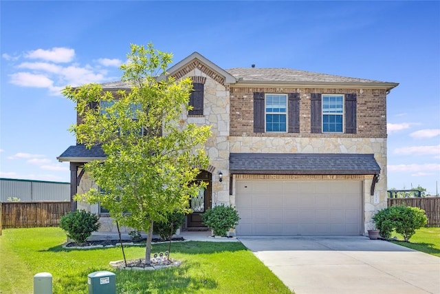 traditional-style home with a front lawn, driveway, stone siding, and fence