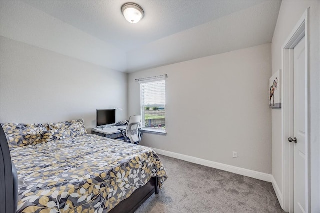 bedroom with carpet floors and baseboards