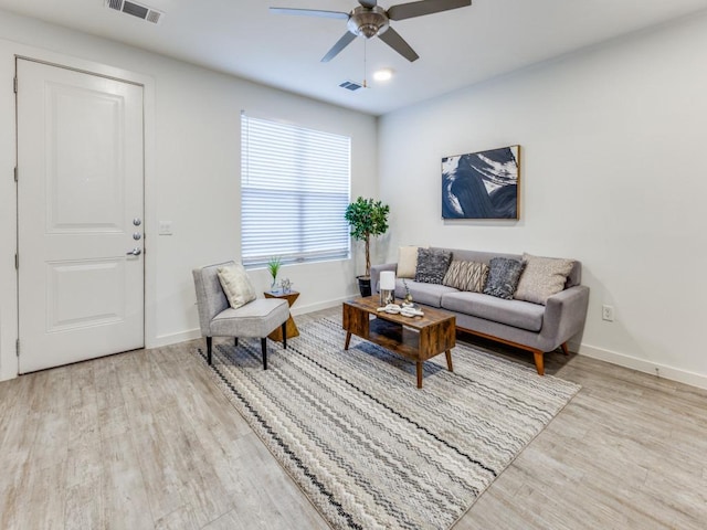 7805 Cooper Ln Unit 103, Austin, TX 78745 - living room featuring baseboards, a ceiling fan, visible vents, and wood finished floors