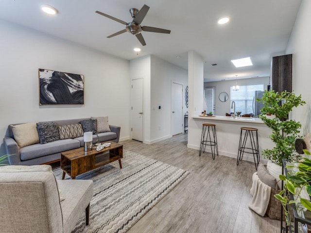7805 Cooper Ln Unit 103, Austin, TX 78745 - living room with baseboards, recessed lighting, light wood-style floors, and ceiling fan