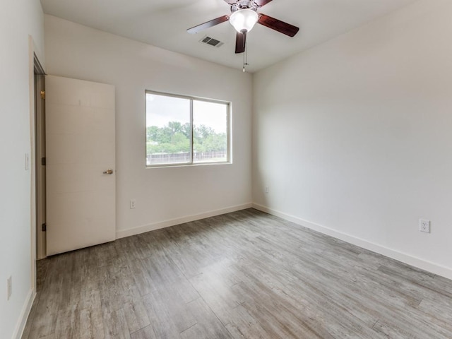 7805 Cooper Ln Unit 103, Austin, TX 78745 - unfurnished room featuring visible vents, wood finished floors, baseboards, and ceiling fan