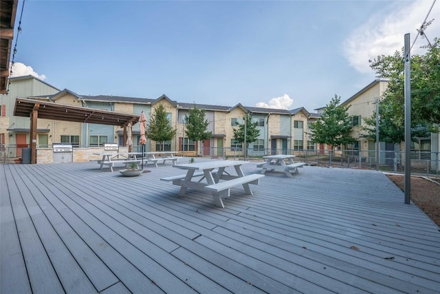 7805 Cooper Ln Unit 103, Austin, TX 78745 - wooden deck featuring an outdoor kitchen, a residential view, grilling area, and fence
