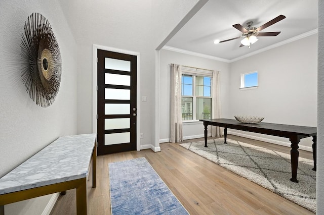 233 Abbeyville Walk, Austin, TX 78738 - foyer entrance with ornamental molding, light wood-style flooring, ceiling fan, and baseboards