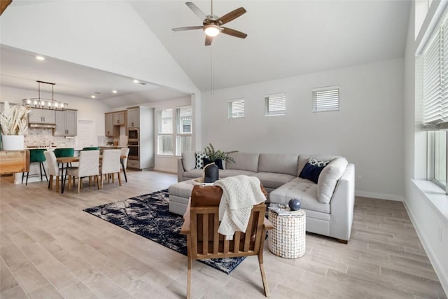1109 Sweetspire St, Leander, TX 78641 - living area featuring a ceiling fan, light wood-style flooring, recessed lighting, baseboards, and vaulted ceiling