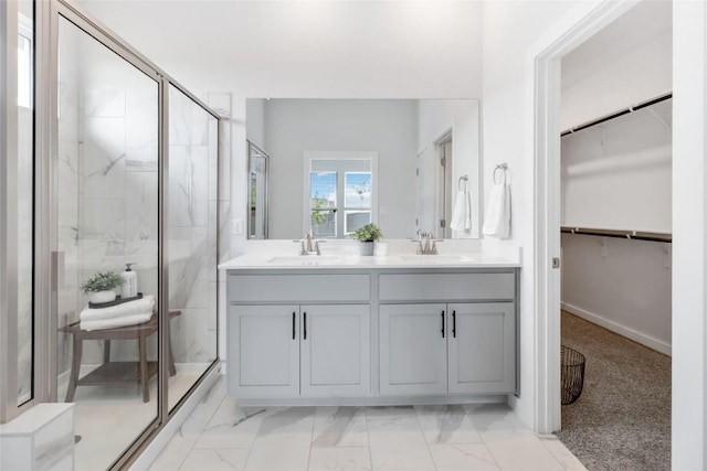 1109 Sweetspire St, Leander, TX 78641 - full bathroom featuring a marble finish shower, marble finish flooring, a walk in closet, and double vanity