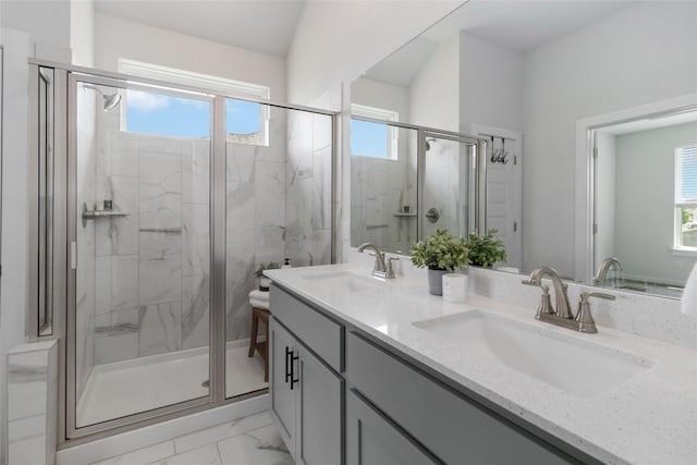 1109 Sweetspire St, Leander, TX 78641 - bathroom featuring a marble finish shower, double vanity, and marble finish flooring