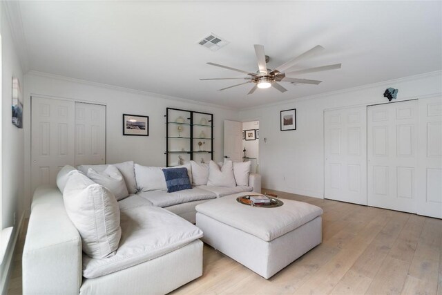 11009 Midbury Ct, Austin, TX 78748 - living room with a ceiling fan, ornamental molding, light wood-style flooring, and visible vents