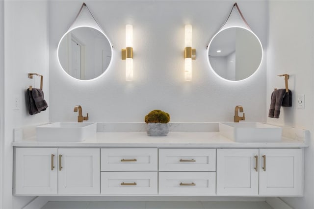 bathroom with a sink and double vanity