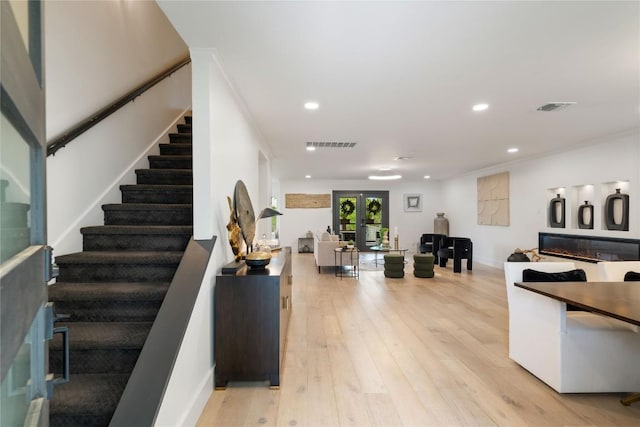 interior space featuring french doors, stairs, and visible vents