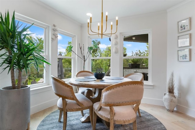 sunroom / solarium featuring a chandelier