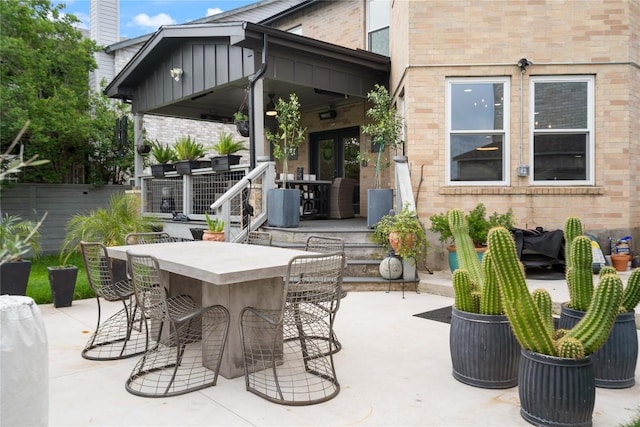 view of patio featuring fence and outdoor dry bar
